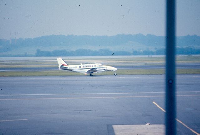 Beechcraft Airliner (N135HA) - Beach 99 of Henson Airways (Allegheny Commuter) taxis at KDCA Circa 1965-70