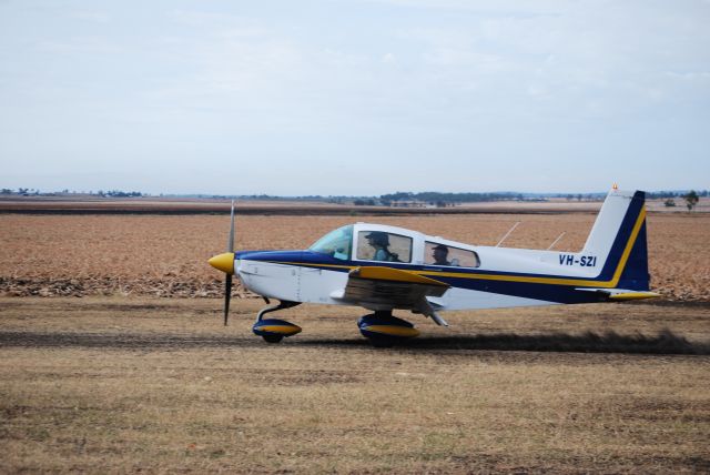 Grumman AA-5 Tiger (VH-SZI) - Grumman kicks up some dust on landing at Clifton, Qld, Australia