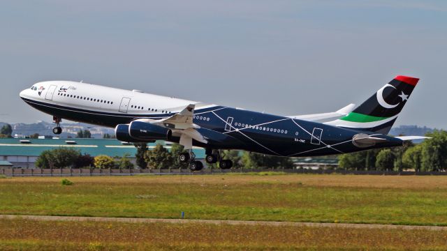 Airbus A340-200 (5A-ONE) - Take-off. View from"rue du berger"