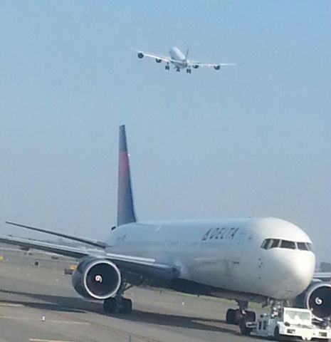 BOEING 767-300 (N156DL) - Delta Airlines B767-300  at the Background IBERIA A330-200 on it's way to MAD