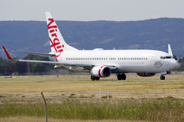 Boeing 737-800 (VH-VOK) - On taxi-way heading for take off on runway 05. Friday 19th April 2013.