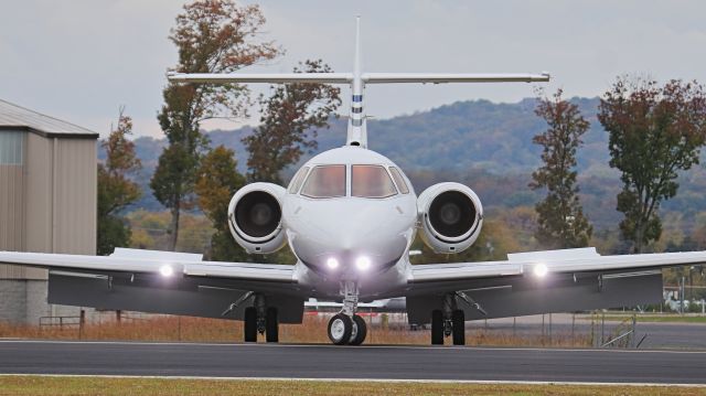 Hawker 800 (N68CB) - October 27, 2018, Lebanon, TN -- Cracker Barrel corporate jet taxiing to their hanger after arriving on runway 19.