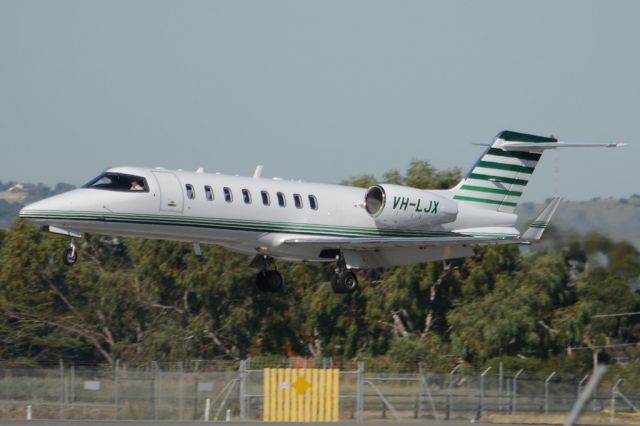 Learjet 35 (VH-LJX) - About to put down on runway 05. Wednesday, 21st May 2014.