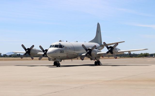 Lockheed P-3 Orion (16-3294) - KRDD - super rare at Redding, CA "Bloodhound 303" I just happened to leave for break late about 11:40am today 6/19/2018 and arriving from the south was a PSA .....err I mean US Navy P-3C on a very short right base final for Runway 34 smokin a la 1967 at San Jose from Orange County. But it was Bloodhound 303 from Pt. Mugu NAS on an Air Test and Evaluation with Squadron 30 deciding to drop in to quiet Redding, CA and thank you. The crew of 5? was walking into the Redding Airport FBO (Redding Jet center) when I pulled up for a few pictures of this P-3C its been many years since Ive seen a P-3C in the air - I could not believe my luck, as I knew I did not have a chip in the camera in the car......but a nice electrical engineer had an extra chip on his desk and I was off to the airport soon after for lunch. Good thing, as they were gone when I left work at 330pm.