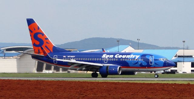 Boeing 737-700 (N715SY) - A Boeing 737-700 rolling down Runway 18R just after landing  @ Huntsville International, AL - August 28, 2016