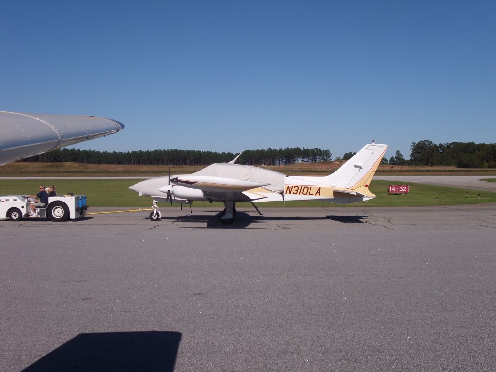 Cessna 310 (N310LA) - Moving from one side of the field to the other
