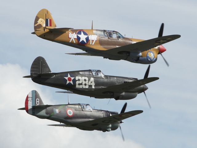 — — - Holding an almost perfect formation, from this angle at least! Warbirds flypast at Flying Legends 2012.