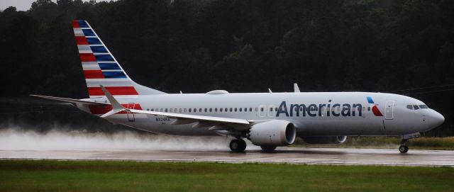 Boeing 737 MAX 8 (N324RA) - I know this pic looks grainy - its actually rain.  We had a huge storm wash out the airport, but getting soaked was worth it; this was Americans first MAX to come to RDU! Leaving it here for posterity.  On 5/28/18.