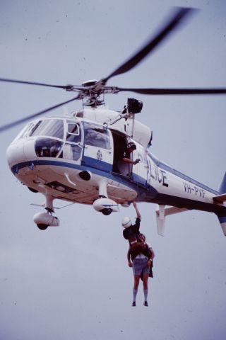 VH-PVF — - Taken at Lilydale Airshow 1982.  A willing civilian dressed for the era is winched into VicPols first helicopter, a Aérospatiale SA365C1 Dauphin 2. 