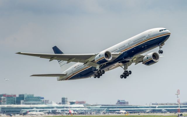 Boeing 777-200 (EC-MIA) - This Privilege Style 777 has been used by EL AL for the  last couple of weeks. Seen here blasting off runway 23 at YYZ