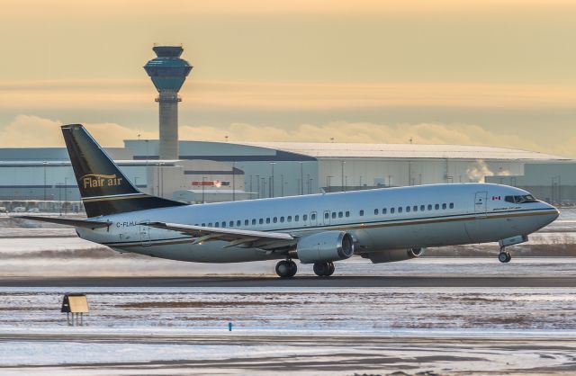 BOEING 737-400 (C-FLHJ) - Flair Air lifts the nose wheel off runway 23 and heads to Winnipeg