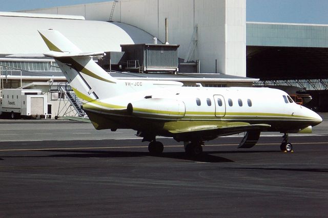 Robinson R-22 (VH-JCC) - BRITISH AEROSPACE HS125-700 - REG : VH-JCC (CN 257046) - ADELAIDE INTERNATIONAL AIRPORT SA. AUSTRALIA - YPAD 35MM SLIDE CONVERSION USING A LIGHTBOX AND A NIKON P80 DIGITAL CAMERA IN THE MACRO MODE.14/12/1984