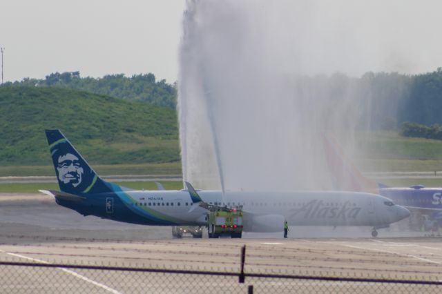 Boeing 737-900 (N247AK) - Alaska 737-900 getting a water canon salute for its inaugural flight out of CVG