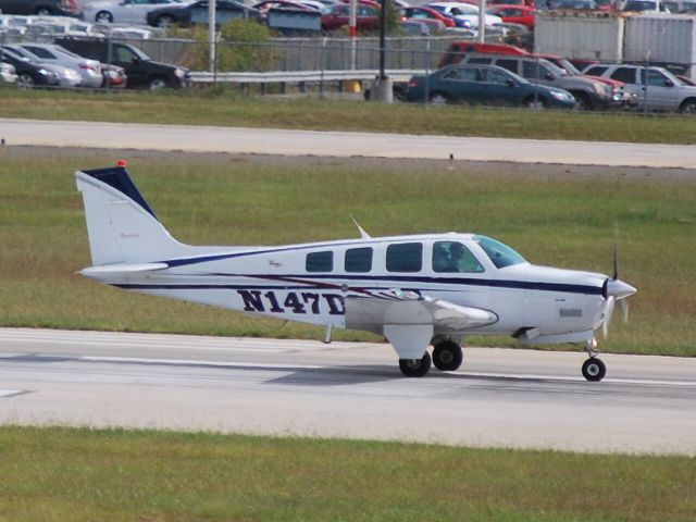 Beechcraft Bonanza (36) (N147DD) - Rolling down runway 18C - 10/4/09