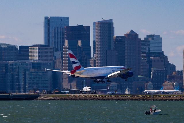 Airbus A380-800 (G-XLEG) - A380 arrives with smaller aircraft waiting.