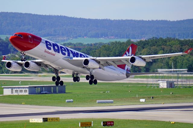 Airbus A340-300 (HB-JMF) - Edelweiss A340-300 departing runway 16 at Zurich (September 2022).