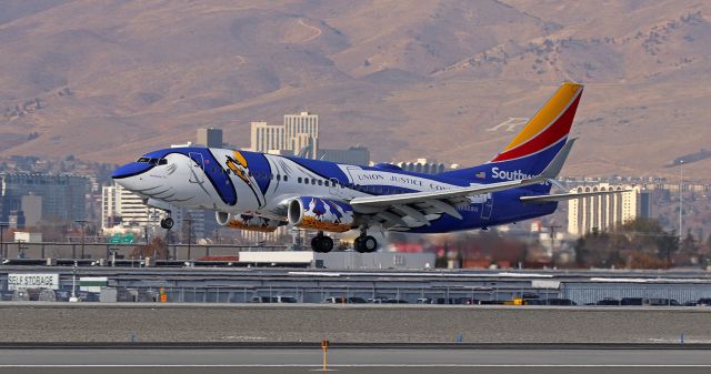 Boeing 737-700 (N946WN) - With downtown Reno as a backdrop, N946WN, dressed in Southwest's "Louisiana One" livery, is about to complete a trip from Denver as it nears touchdown on 17R.  