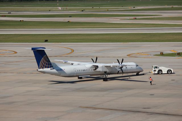 de Havilland Dash 8-400 (N204WQ) - 081415 United to Denver on pushback from north concourse