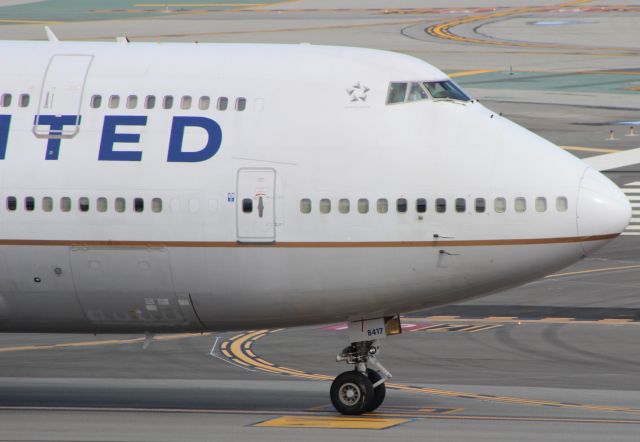 Boeing 747-400 (N117UA) - Taxiing to G.