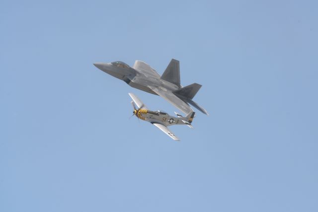 Lockheed F-22 Raptor — - F-22 Raptor in formation with P-51 Mustang at Quinte International Air Show.