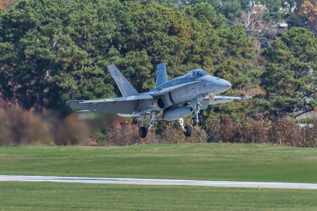 McDonnell Douglas FA-18 Hornet — - Great shot of an FA-18 landing in Atlanta's PDK airport with heavy exhaust gasses being emitted. The pilot was on a training flight and was stopping to see a friend. Questions about this photo can be sent to Info@FlewShots.com