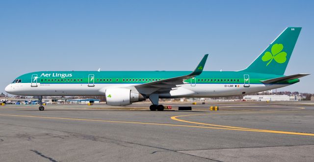 Boeing 757-200 (EI-LBR) - Freshly painted Kelly green EI-LBR gleaming in the early spring sun @ KBOS Logan Airport on FlightAware.Com !