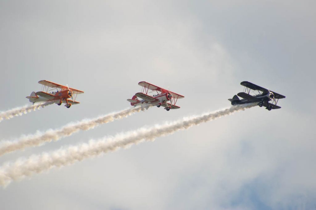 N806R8 — - Three Boeing Stearman are in formation during their performance at the Fly Iowa Airshow 2019. In the lead is a black and white Stearman registered as N5556R, followed by a Stearman in "Red Baron" colorers registered as N806R8, and finally N69249 named 'Dreamsicle',an orange and white Stearman. Photo taken August 2, 2019 with Nikon D3200 at 400mm.n