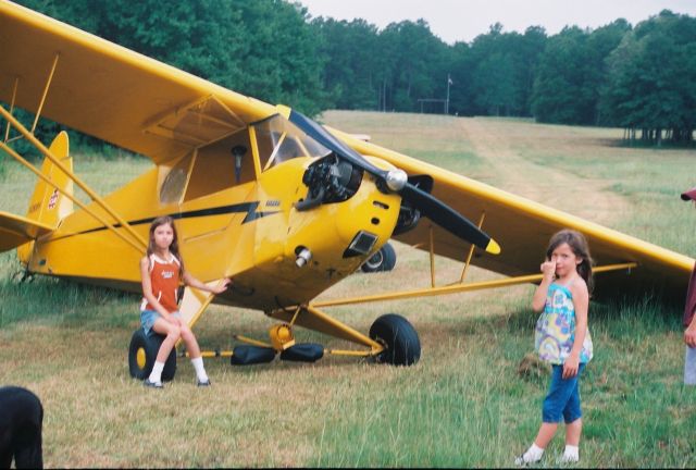 N28089 — - Bolt in Cabane Vee broke on roll out with grand daughter as co-pilot.  She is the beauty sitting on the wheel.  The one picking her nose is her sister.  No real harm done to A/C.  Note the curve in the runway.  Note the BIG trees at threshold.