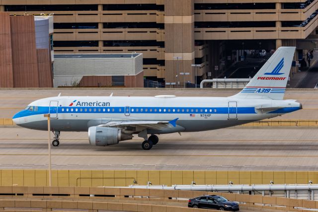 Airbus A319 (N744P) - An American Airlines A319 in Piedmont retro livery taxiing at PHX on 2/13/23, the busiest day in PHX history, during the Super Bowl rush. Taken with a Canon R7 and Canon EF 100-400 II L lens.