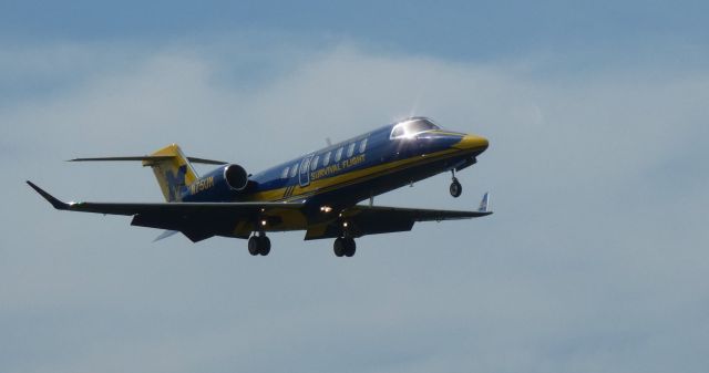 Bombardier Learjet 75 (N75UM) - On short final is this 2017 Learjet 75 in the Summer of 2022. University of Michigan medevac aircraft.