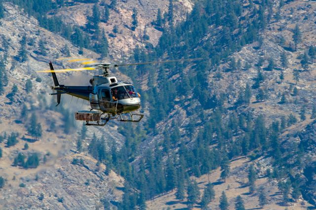 C-GZGN — - Aerospatiale AS-350B dropping supplies in to wildfire firefighters.