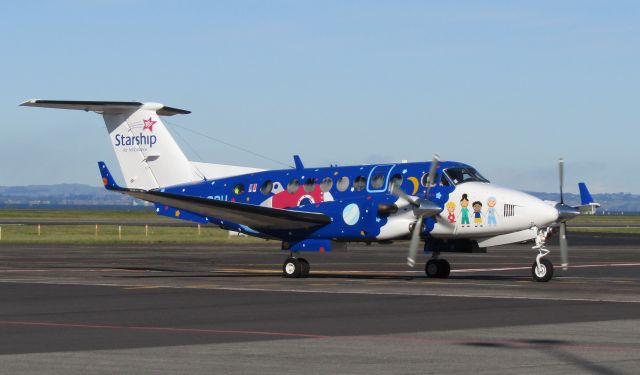 Beechcraft Super King Air 300 (ZK-SSH) - The brilliantly coloured SSH taxiing into the regional apron.