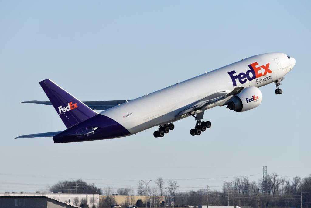 BOEING 777-200LR (N857FD) - 23-L Departure