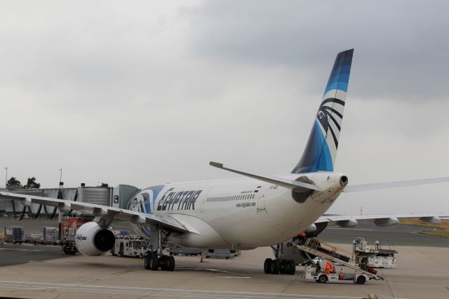 Airbus A330-300 (SU-GDS) - Egyptair (MS) SU-GDS A330-343 [cn1143]br /Paris Charles de Gaulle (CDG). Egyptair flight MS800 to Cairo (CAI) awaits departure from the gate at an overcast Paris.br /Taken from Terminal 1 arrivals level.br /2018 08 09br /a rel=nofollow href=http://alphayankee.smugmug.com/Airlines-and-Airliners-Portfolio/Airlines/MIDDLE-EAST-AFRICA/Egyptair-MS/https://alphayankee.smugmug.com/Airlines-and-Airliners-Portfolio/Airlines/MIDDLE-EAST-AFRICA/Egyptair-MS//a