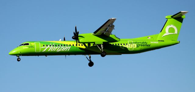 de Havilland Dash 8-200 (N438QX) - Landing 30L, With completed paint job to previously posted image