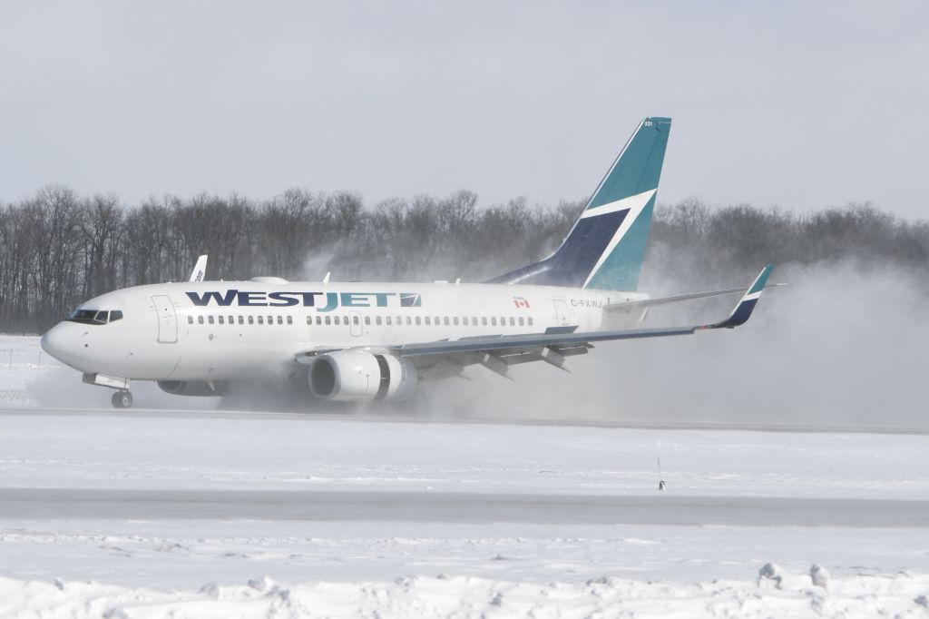 Boeing 737-700 (C-FXWJ) - February 18, 2007 - braked with snow into air at London Airport 