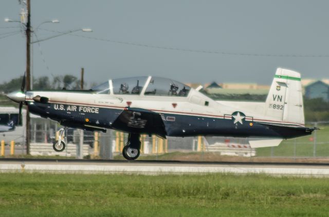 N7892 — - The guys in the cockpit look as if they're returning from a combat sortie.