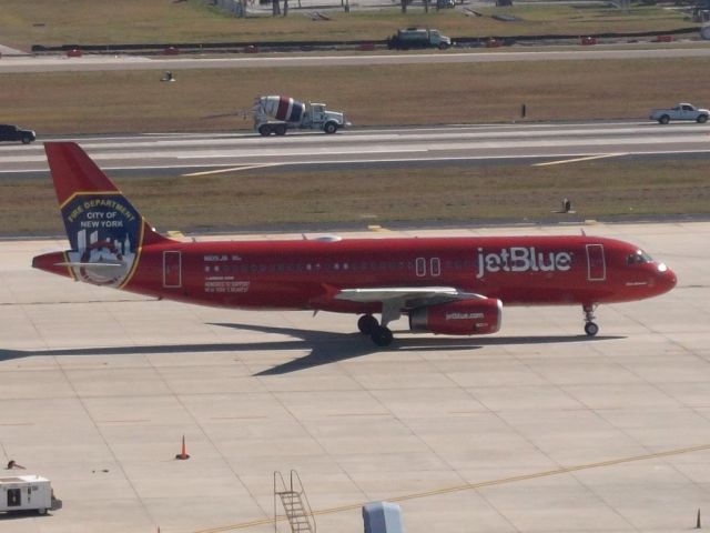 Airbus A320 (N615JB) - Special livery 'FDNY ' 'Blue Bravest' taxis to the gate after arrival.