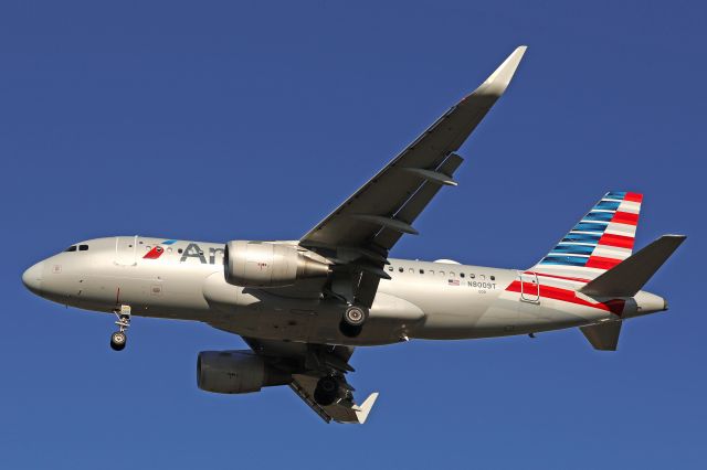 Airbus A319 (N8009T) - Deep blue skies above AAL2021, on final for RWY 24R from Charlotte/Douglas Intl (KCLT) this fine Monday morning (8 Nov 2021).