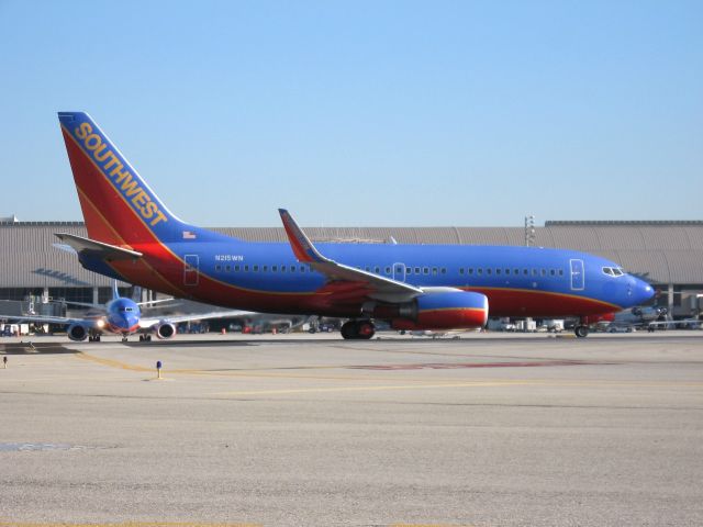 Boeing 737-700 (N215WN) - Holding on RWY 19R