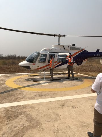 Z-BHP — - About to board for helicopter flight over Victoria Falls 