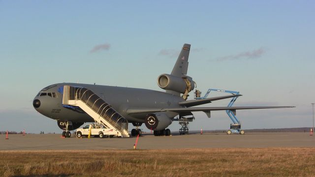 — — - Crews perform maintenance work on a McDonnell Douglas KC-10 Extender at Gander International Airport.