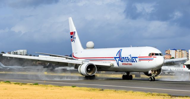 BOEING 767-300 (N373CM) - Amerijet white tail Boeing 767 heavy N373CM breaking on a wet runaway at St Maarten. 22/02/2019