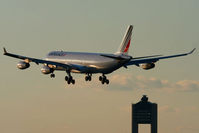 Airbus A340-300 (F-GLZM) - Air France 338 heavy over the numbers to runway 27, arriving from Paris, France. Photo taken on November 18, 2011