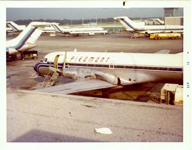 — — - This was taken from the observation deck at the junction of the concourse in ATL in 1974. One side went to the very busy EA/PI/SO concourse, the other went to NWA, and I cant remember who else shared that one except that it was ALWAYS packed! I recall that this YS-11 was preparing for a 5 stop trip from ATL to DCA. 