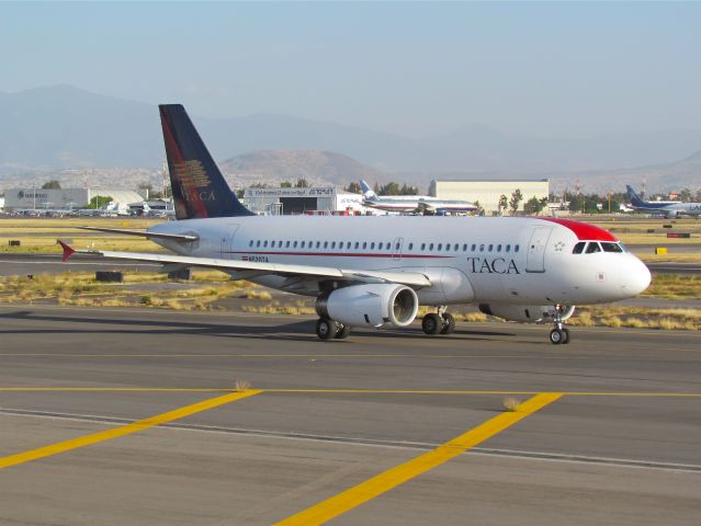 Airbus A319 (N520TA) - Airbus 319-132 N520TA, MSN 3248 and 13 years old, with TACA´s old colors is taxiing to runway 05L for take off in Mexico City Airport (Photo Aug 14th 2011).