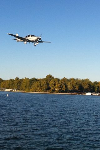 Cirrus SR-22 (N567PA) - Lifting off runway 17 over the lake.