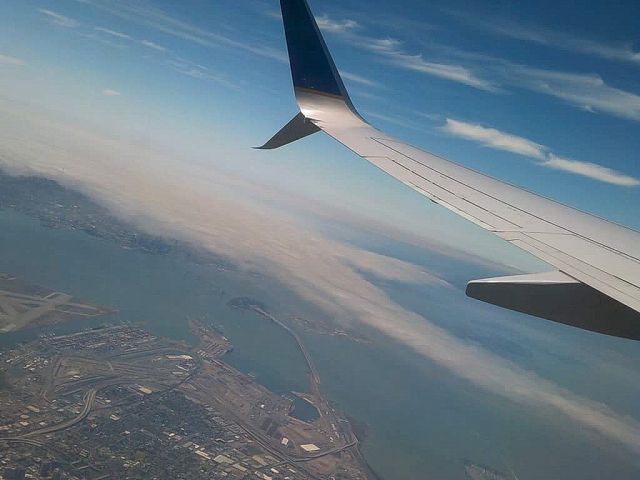 — — - Departure from KSFO flight to KPDX, flight over Oakland, USA