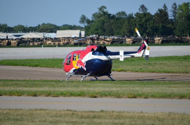 N133EH — - EAA 2011 Red Bull helicopter MBB BO-105 taking a rest after performing.