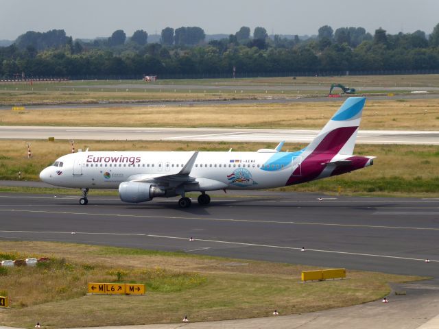 Airbus A320 (D-AEWK) - Eurowings A320-200 D-AEWK making ad for Croatia ... Having landed on 23L DUS and taxiing to terminal, 30.06.2019.